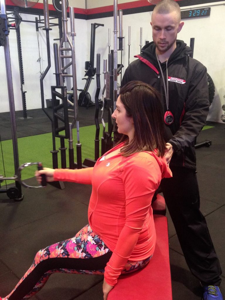 Chrissy training with Sean while pregnant.